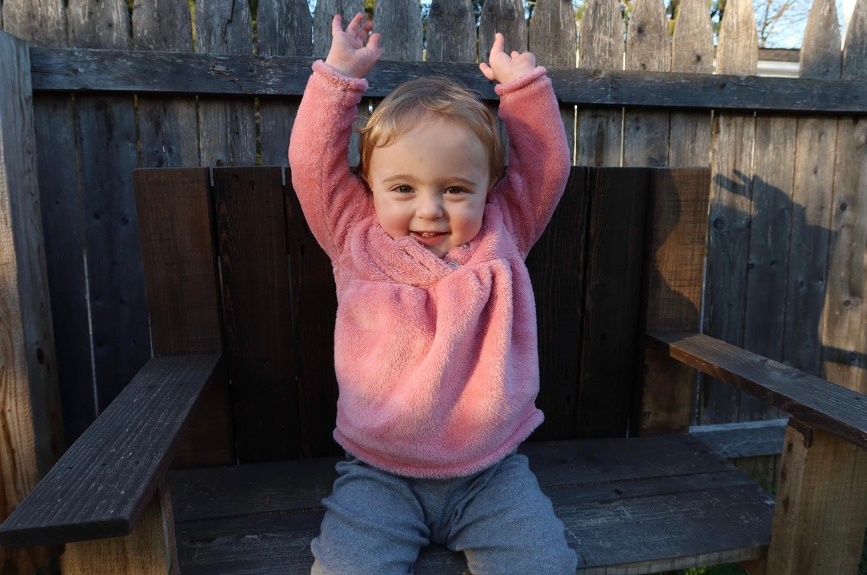 PLAYTIME — Sloane Rose Hurlbut throws up her hands and smiles as she enjoys some recent playtime. The happy, healthy Remsen toddler was born prematurely. Her parents are sharing their story, marking Premature Birth Awareness Month this November with the aim of helping others.