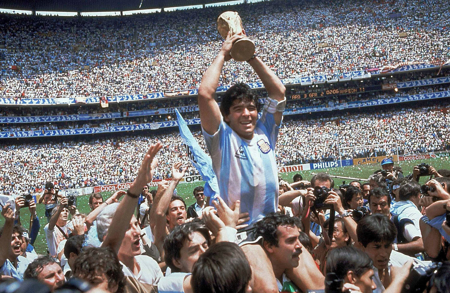 SOCCER LEGEND DIES — In this June 29, 1986, file photo, Diego Maradona holds up his team’s trophy after Argentina’s 3-2 victory over West Germany at the World Cup final soccer match at Azteca Stadium in Mexico City. The Argentine soccer great, who was among the best players ever and who led his country to the 1986 World Cup title before later struggling with cocaine use and obesity, died from a heart attack on Wednesday at his home in Buenos Aires. He was 60.