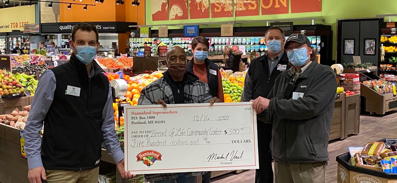 SUPPLYING SOME DOUGH TO FIGHT HUNGER — Store officials at Hannaford Supermarkets, 808 W. Chestnut St., donate a $500 gift card to the Bread of Life Community Center to help feed the hungry in the city during a recent ceremony at the store.  From left: Matt Coffey, assistant store manager; Pastor Arthur Atkins, of the Bread of Life Community Center; Angela Laskowski, manager of customer service; Kevin King, store manager; and Mike Park, assistant store manager.