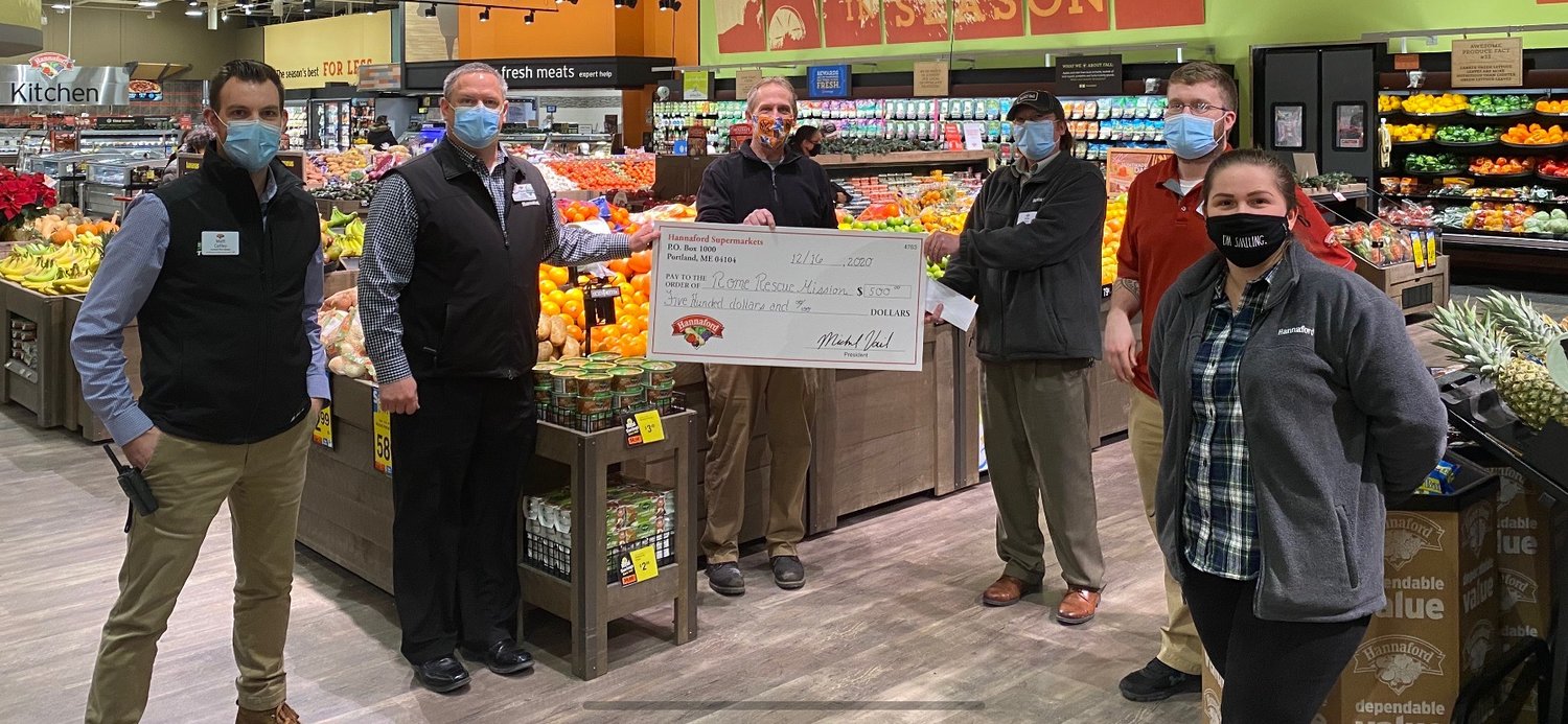 HELP FOR THE HUNGRY — Members of the Rome Hannaford leadership team gather with Matthew Miller, executive director of the Rome Rescue Mission, during a recent socially distant donation ceremony. The company gave a $500 gift card to the mission to help with local hunger relief efforts. From left: Matt Coffey, assistant store manager; Kevin King, store manager; Miller; Mike Park, assistant store manager; Josh Moynihan, center store manager; and Ilda Sipic, produce manager.