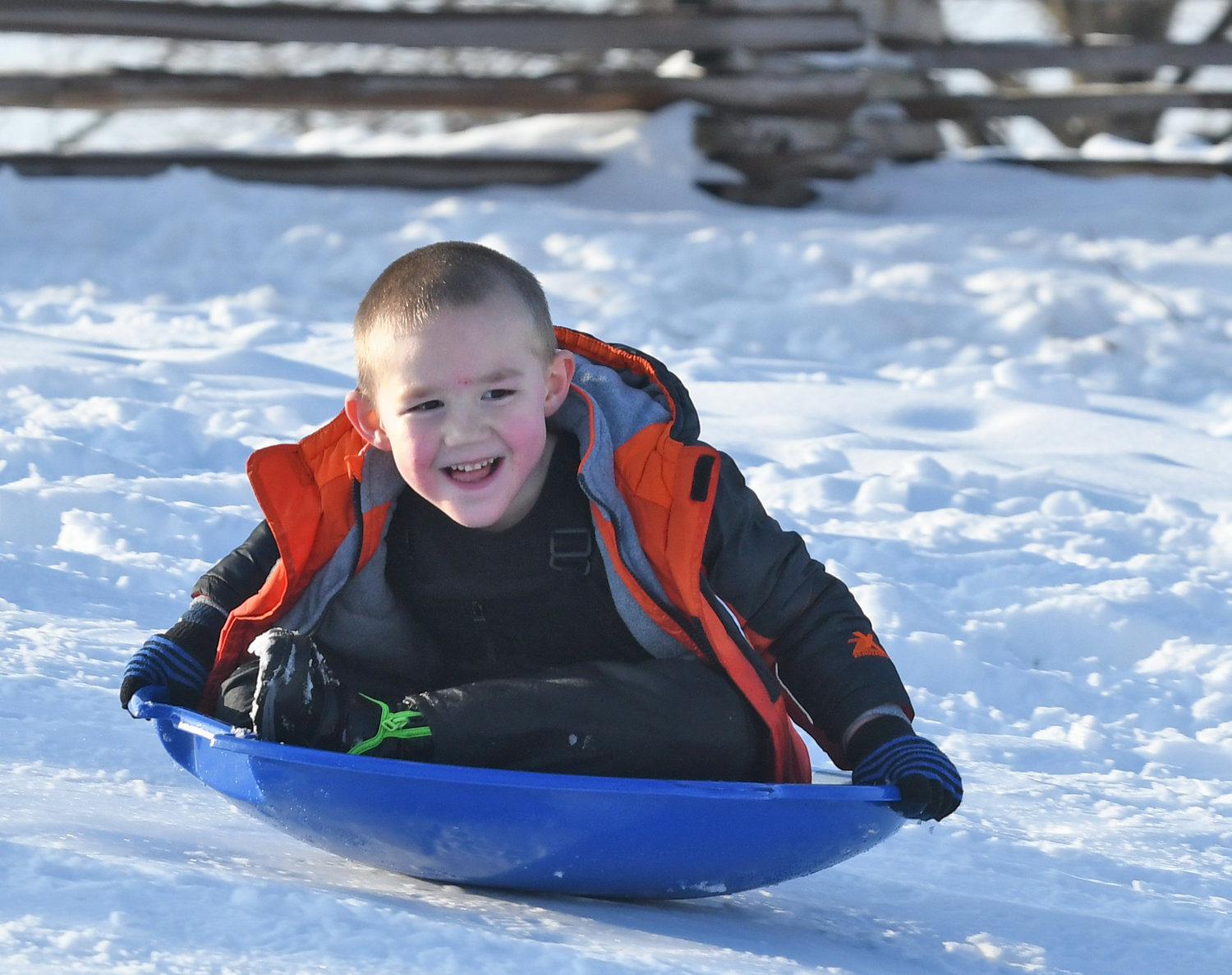 SOME SNOWY FUN — Julian Snyder slides down a hill at Lee Town Park on Monday afternoon. He was there with his mom Rochelle Snyder and grandmother Laura Nolan, both of Rome.