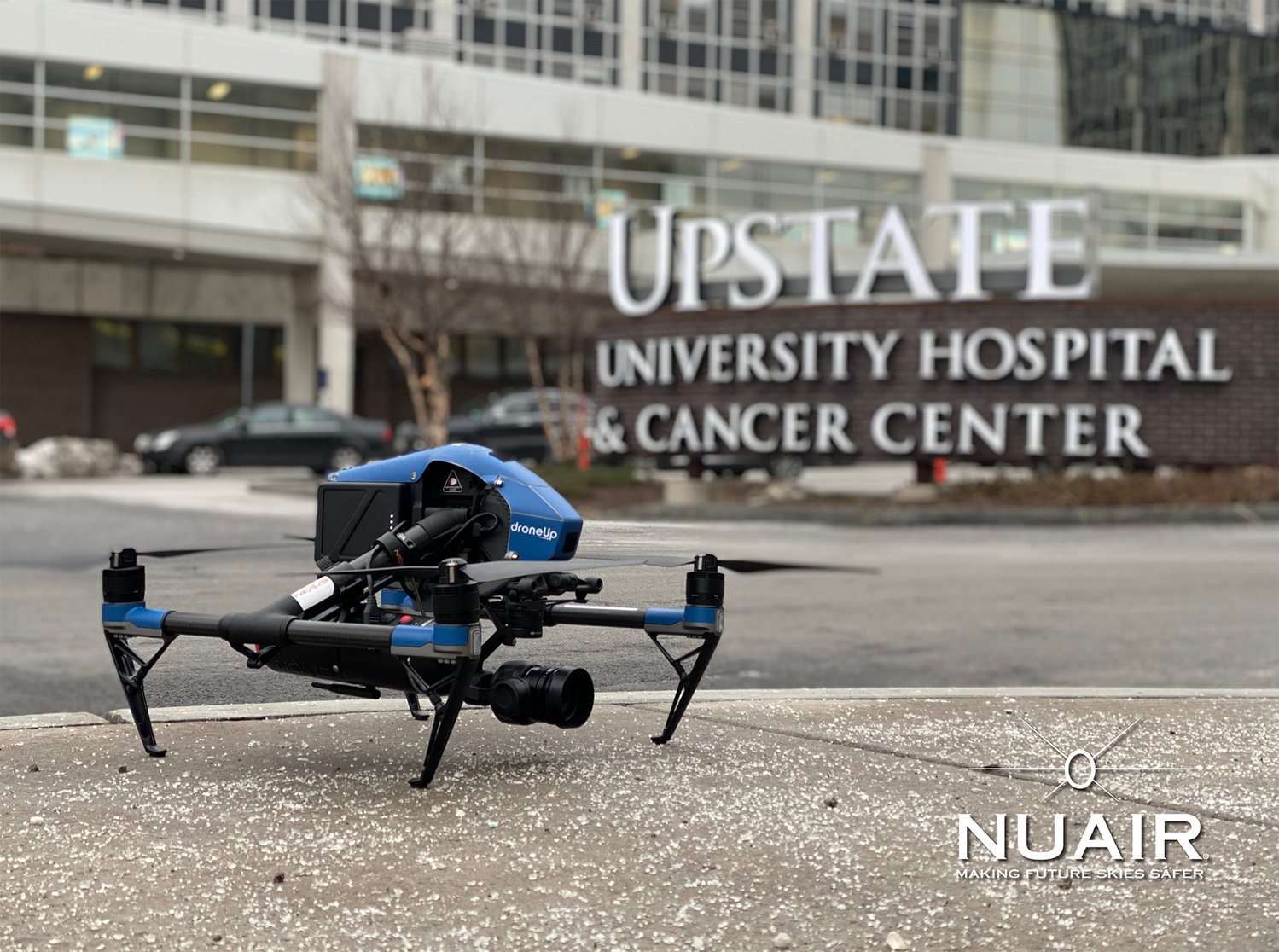 MISSION ACCOMPLISHED — An unmanned aerial system (drone) rests on the sidewalk after a successful test mission to see how the systems can aid in the ongoing fight against COVID-19. The drone performed a series of challenges in Syracuse, demonstrating ways that drones can be used to safely and quickly assist hospitals and other health care professionals.