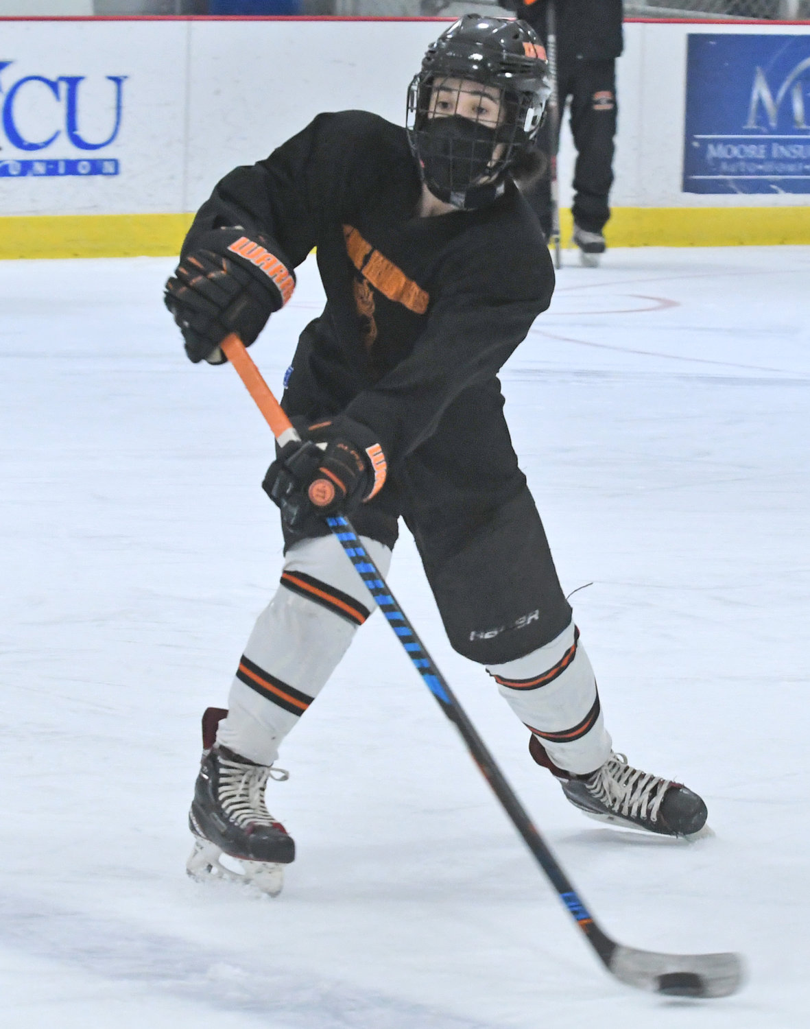 BACK ON THE ICE — Rome Free Academy senior defenseman Jared Hussey makes a pass during practice at Kennedy Arena Monday afternoon. It was the team's first practice as they await a decision from the school district and the county on whether hockey, a high-risk sport due to COVID-19, will be able to take place this winter in Rome.