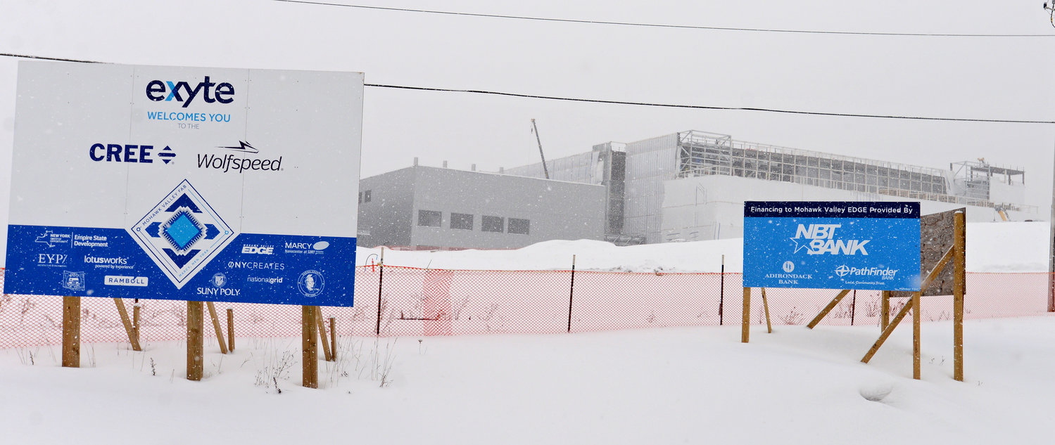 COMING SOON — Exterior of construction at Cree, Marcy’s silicon carbide semiconductor wafer fab site, with signs indicating the site off Edic Road.