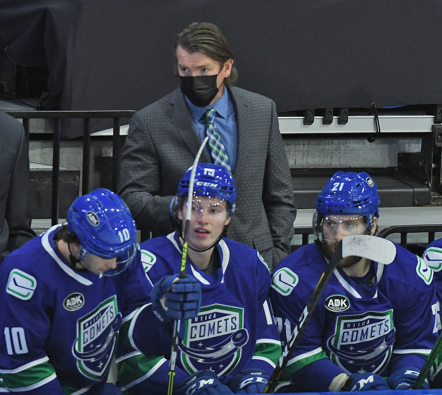 BEHIND THE BENCH — Utica Comets head coach Trent Cull looks on during the first period of Wednesday’s home opener against the Syracuse Crunch. The Comets won 5-2 to improve to 3-1 on the young season.