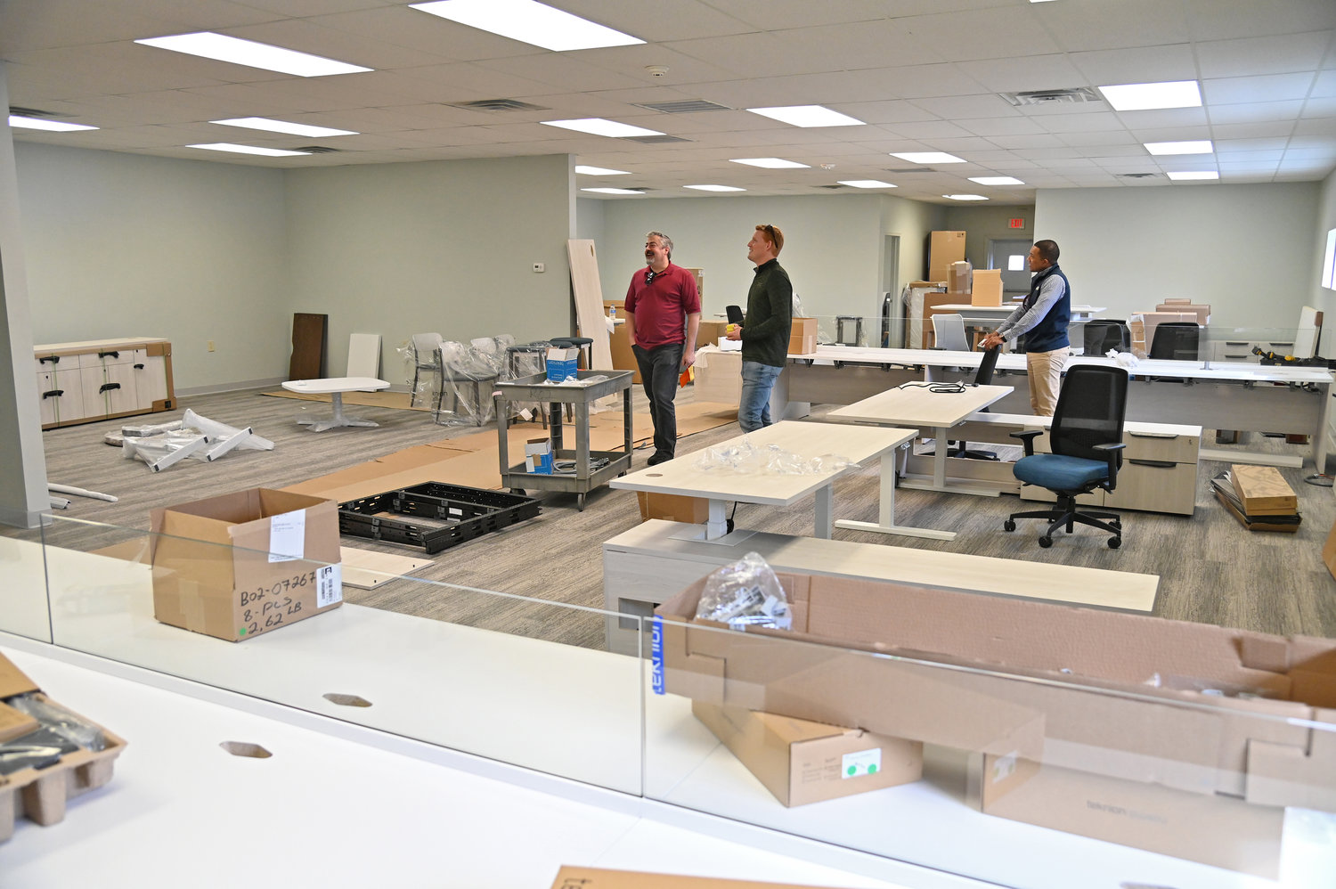 TAKING SHAPE — Daily Sentinel Publisher Bradley Waters, right, discusses the layout of the offices of the future location of the newspaper, 111 Langley Road, with the company’s information technology specialist Dan Bronson.