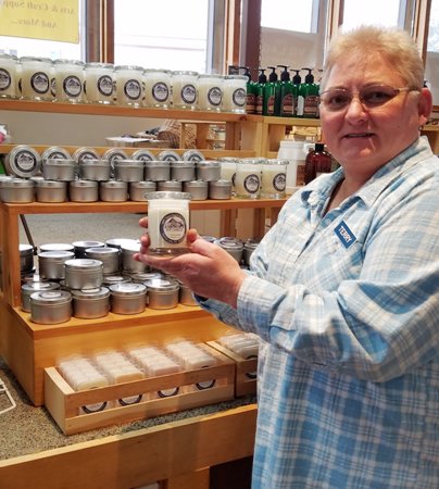 NEW OWNER — Terry Reed of Saranac Lake the new owner of Adirondack Soy Candles.