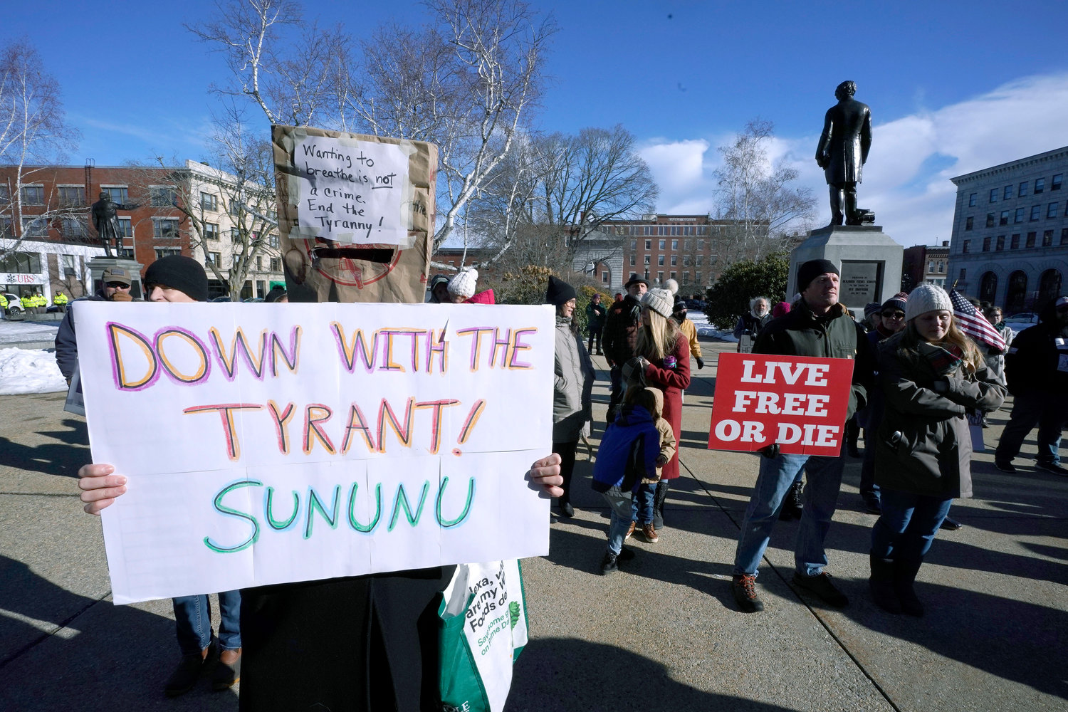 LAWMAKERS SEEK TO LIMIT POWERS — In this January 2021 file photo, people protest outside the Statehouse in Concord, N.H., as Gov. Chris Sununu is inaugurated at noon for his third term as governor. A measure that recently passed New Hampshire’s Republican-led House would prohibit governors from indefinitely renewing emergency declarations.