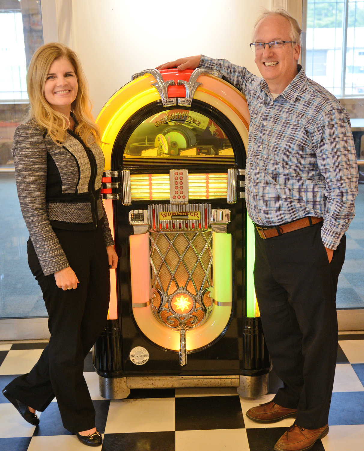 READY FOR REPLAY — Lynn and Steve Boucher stand next to an iconic Wurlitzer juke box at the Soda Fountain in Remsen. The popular family eatery with a retro motif is ready to reopen and serve a variety of traditional, homestyle favorites.
