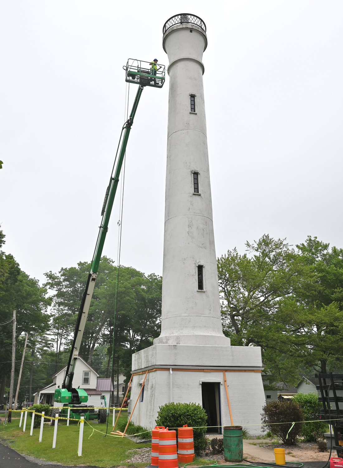 CLEAN — New York Power Authority crews pressure wash the Verona Beach Lighthouse on Wednesday afternoon as preparations are under way for the installation of LED lights as part of the Canal Corporation’s Iconic Lighting Project. The project will help to shine a spotlight on the historic structure and its place along the Erie Canal and Oneida Lake.