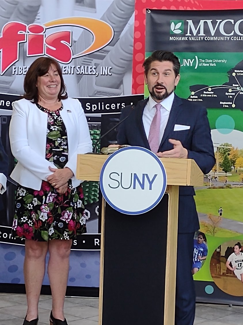 SUNY CHANCELLOR SPEAKS — State University of New York Chancellor Jim Malatras speaks about apprenticeship programs for SUNY students at a Wednesday news conference at Oriskany’s Fiber Instrument Sales. Assemblywoman Marianne Buttenschon looks on.