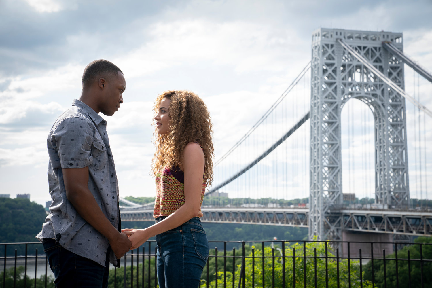 This image released by Warner Bros. Entertainment shows Corey Hawkins, left, and Leslie Grace in a scene from "In the Heights."    (Macall Polay/Warner Bros. Entertainment via AP)