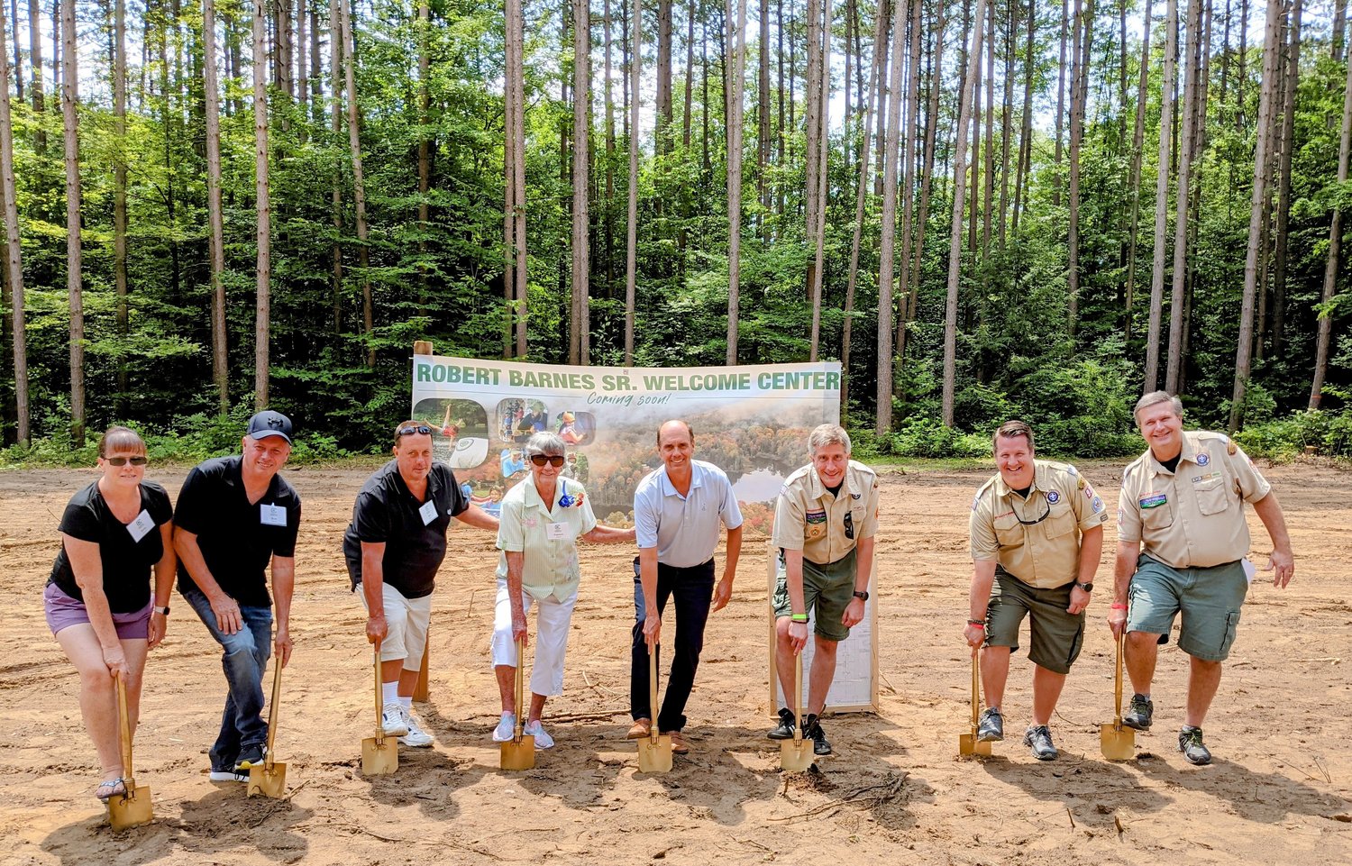 GETTING READY FOR BIG WELCOME (CENTER) — Boy Scout officials, volunteers and donors break ground for the soon-to-be constructed Robert G. “Bob” Barnes, Sr. Welcome Center at Camp Kinglsey, 5328 Tuffy Road, off of North Ava Road, in Ava. The facility, officials said, will be a warm and inviting space for guests to check into camp, relax in the lounge, use the restroom upon arrival and even take care of their health paperwork. From left: Sally Barnes; Bob Barnes, Jr.; Bill Barnes; Patricia Barnes; Steve Barnes; Rob Mahardy, camp director; Matthew Dziedzic, council president; and Raymond Eschenbach, Leatherstocking Council CEO.