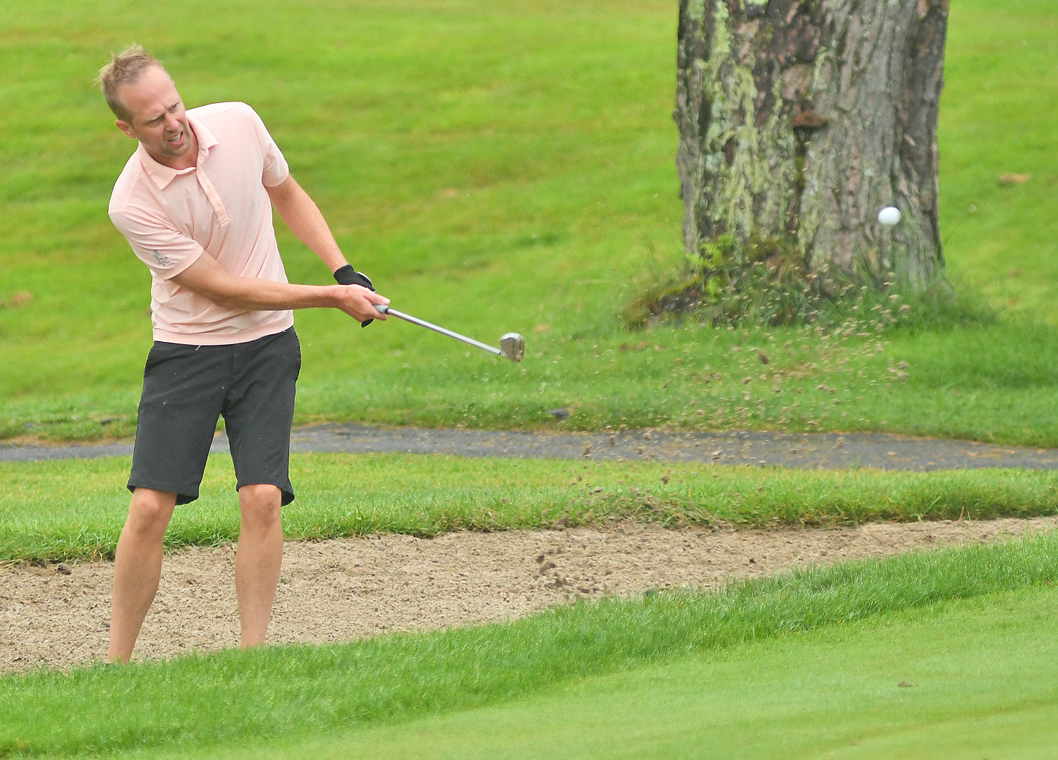 UP AND DOWN — Rome's Wes Cupp hits from the bunker on hole No. 5 during the second round of the Thirsty Owl New York Speedgolf Open at Rome Country Club. Cupp knocked in the sand shot to save par.