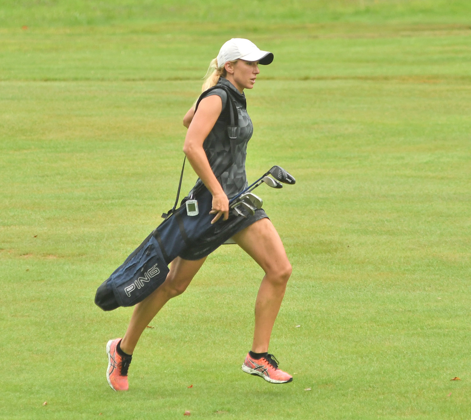 RUNNING TO HER BALL — Rome's Lauren Cupp runs up the 18th fairway after her second shot during the second round of the Thirsty Owl New York Speedgolf Open on Monday morning at Rome Country Club.