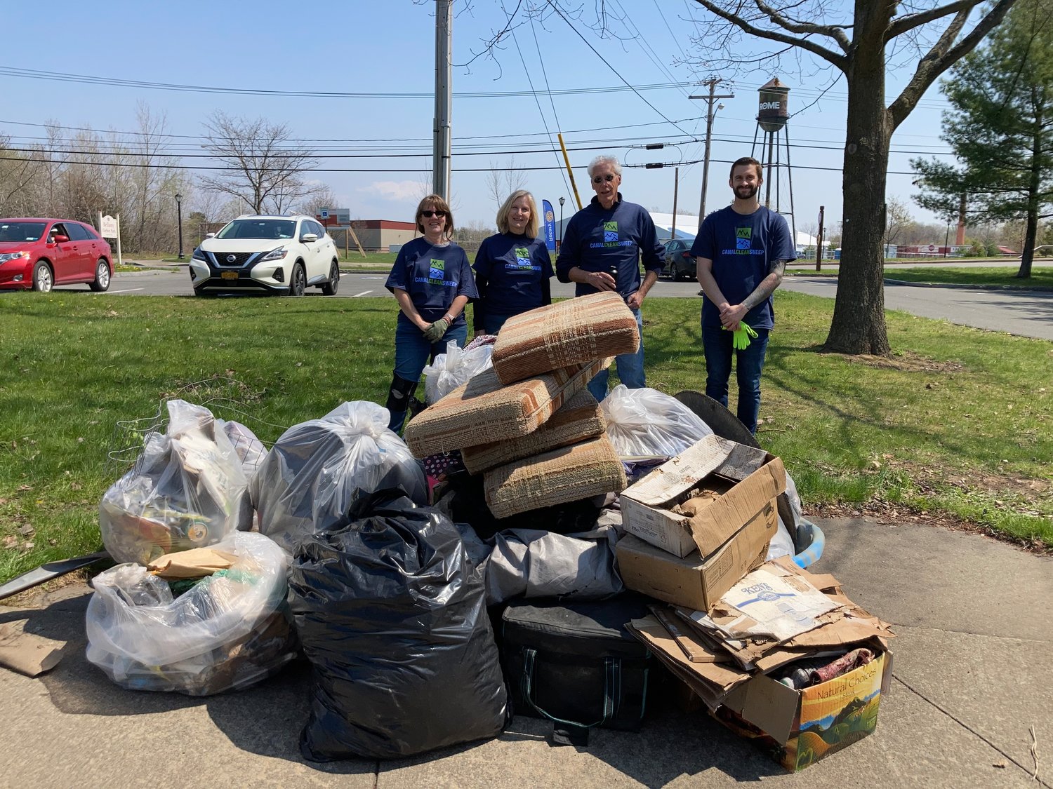 SERVICE ABOVE SELF — Members of Rome Rotary give back to the community by participating in the Earth Day Canal Cleanup. (photo submitted)