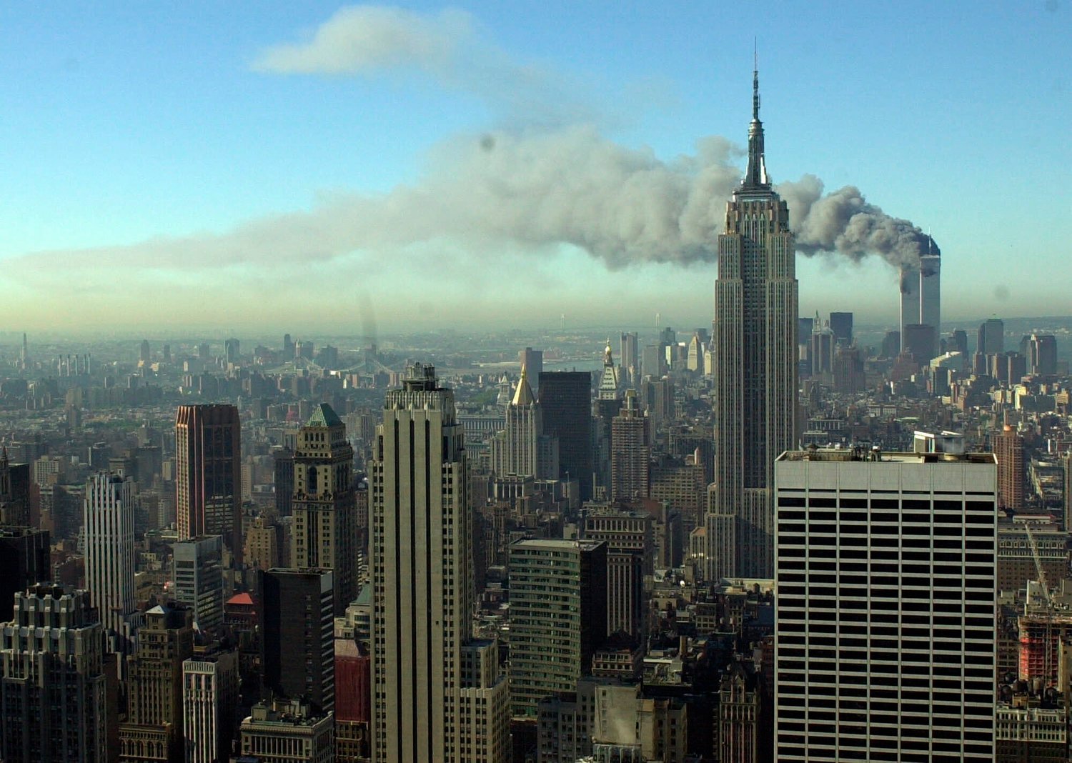 REMEMBERING THE ATTACK — Smoke billows across the New York City skyline after two hijacked planes crashed into the twin towers on Sept. 11, 2001. The Eastern Air Defense Sector, then known as the Northeast Air Defense Sector, played a prominent role responding to the 9/11 attacks. As part of its 20th anniversary memorial efforts, the unit is holding a remembrance ceremony, which will be closed to the public, on Saturday, Sept. 11, at 1 p.m.