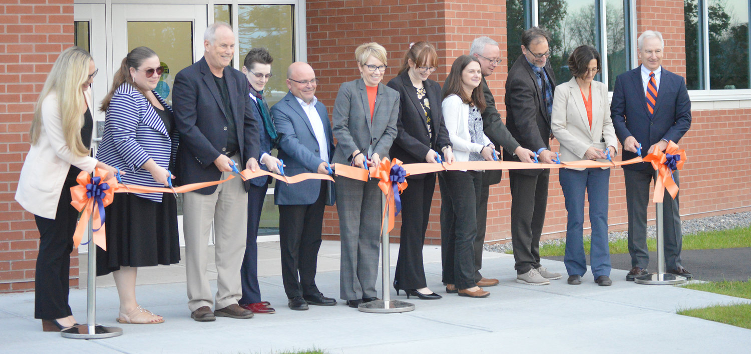CHRISTENING THE NEW BUILDING — Members of Utica College, CS Arch, and Empire State Development cut the ribbon on the new Gordon Science Center Annex on Thursday afternoon.