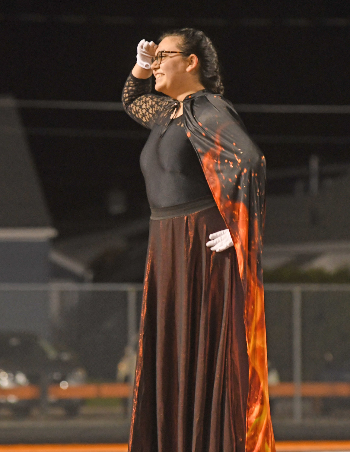 SALUTE — Drum major Madison Short acknowledges the crowd after the RFA Marching Band  performance Wednesday night.
