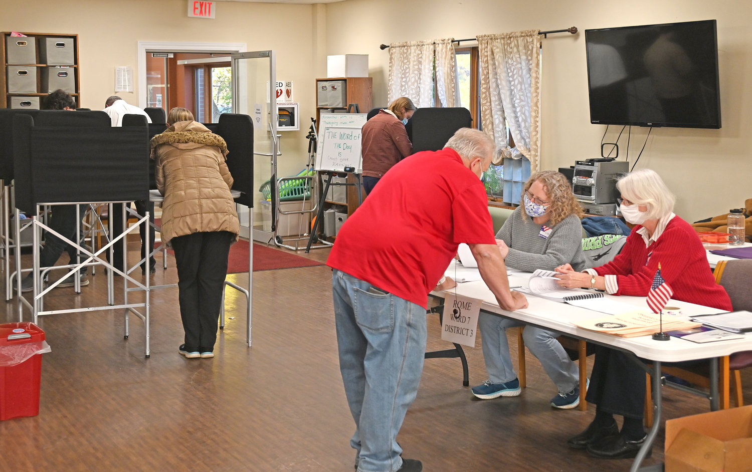BUSTLING — The voting was brisk at the Copper  City Community Connection, 305 E. Locust St., with a steady stream of voters casting their ballots on local races as well as several statewide propositions which were also on the ballot.