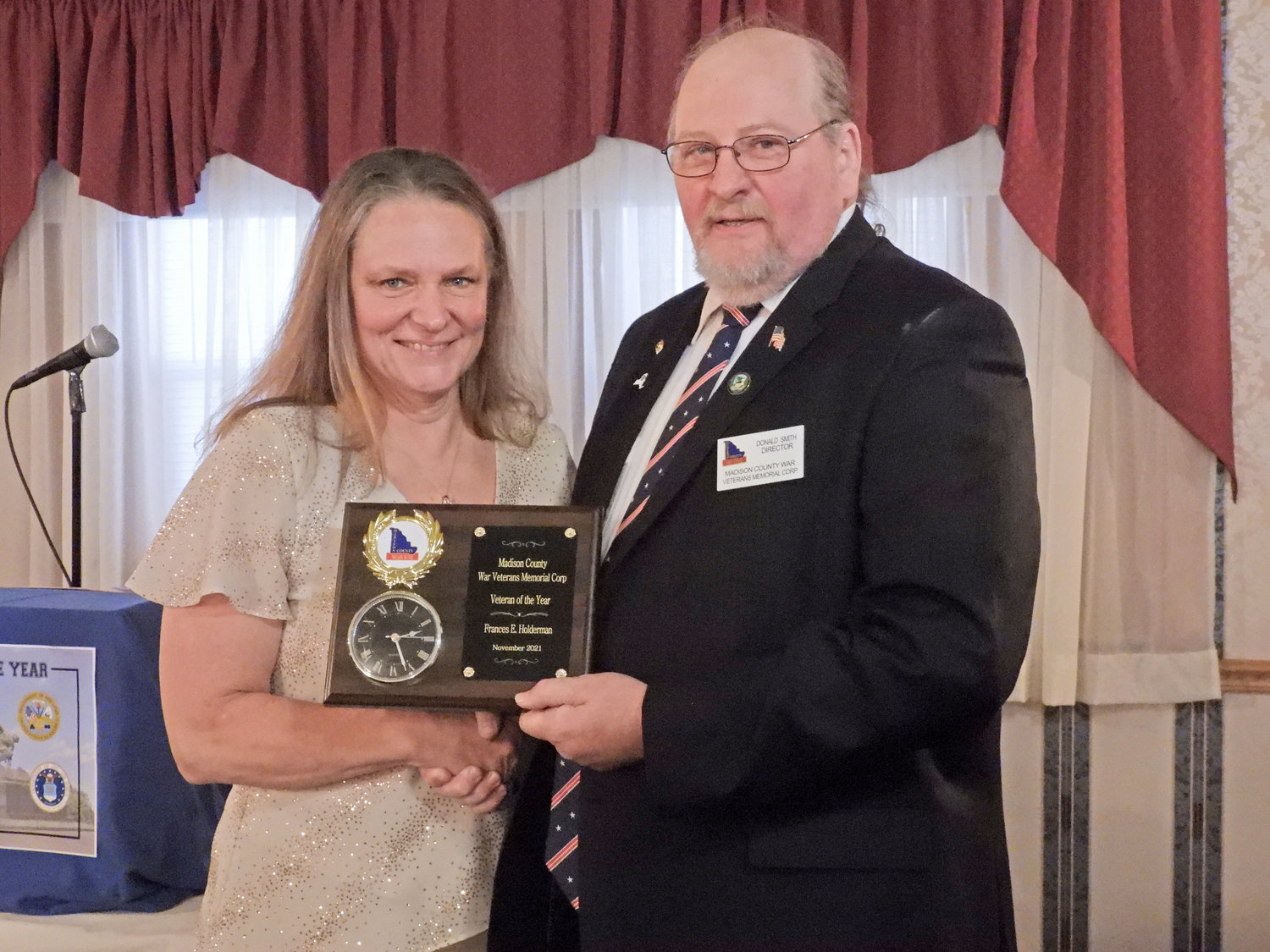 VETERAN OF THE YEAR — WAVEM President Don Smith presents Frances Holderman with the Madison County Veteran of the Year Award, recognizing her for her exemplary military career and service to the community.