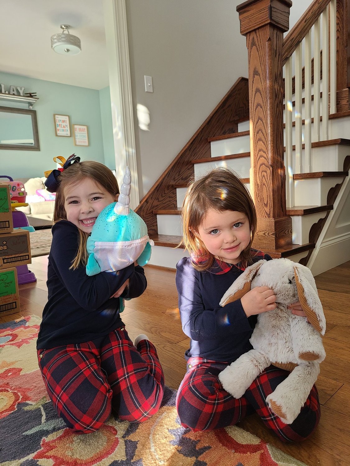 LOVE TO GIVE — Sisters Isabella Todora, 7, and Liliana Todora, 3, hold the Isabella and Liliana & Friends Toy Drive each year to collect toys for needy children.  The drive began as a lesson for the family in how to give back.