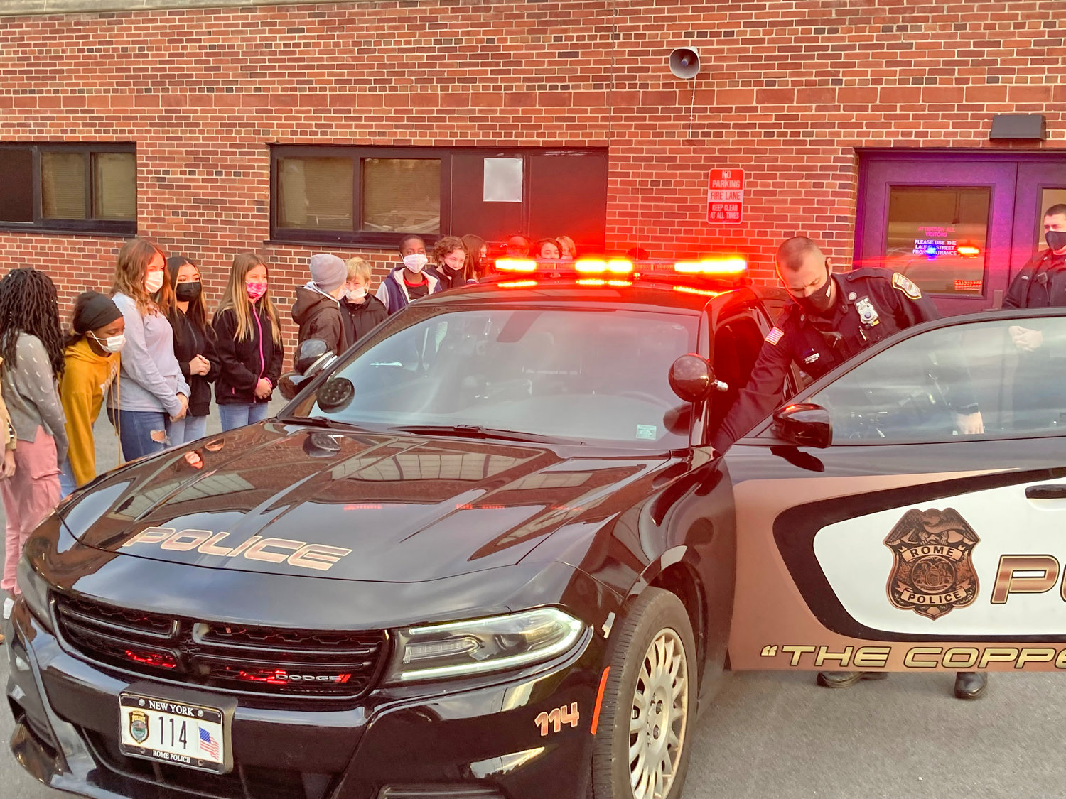 WHO WANTS TO DRIVE? — School resource officers at Strough Middle School recently discussed how students can someday become police officers, including the education requirements involved. They also discussed some of the perks of the job, including how to turn on a squad car’s lights and sirens.