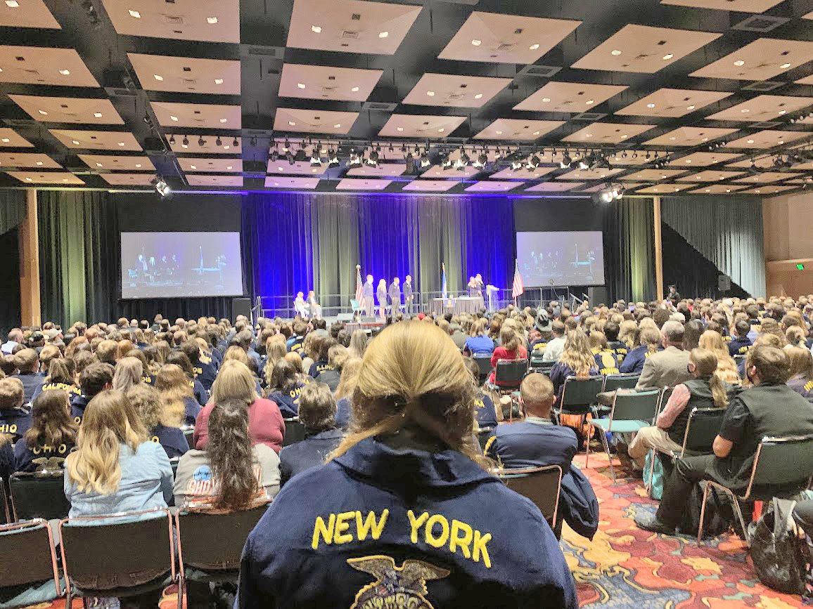 FAST-PACED — VVS FFA Chapter President Elizabeth Schieferstine watches the Parliamentary Procedure competition finals at the FFA National Convention recently. A group of students from the VVS FFA, along with one Madison-Oneida BOCES student, attended the event.