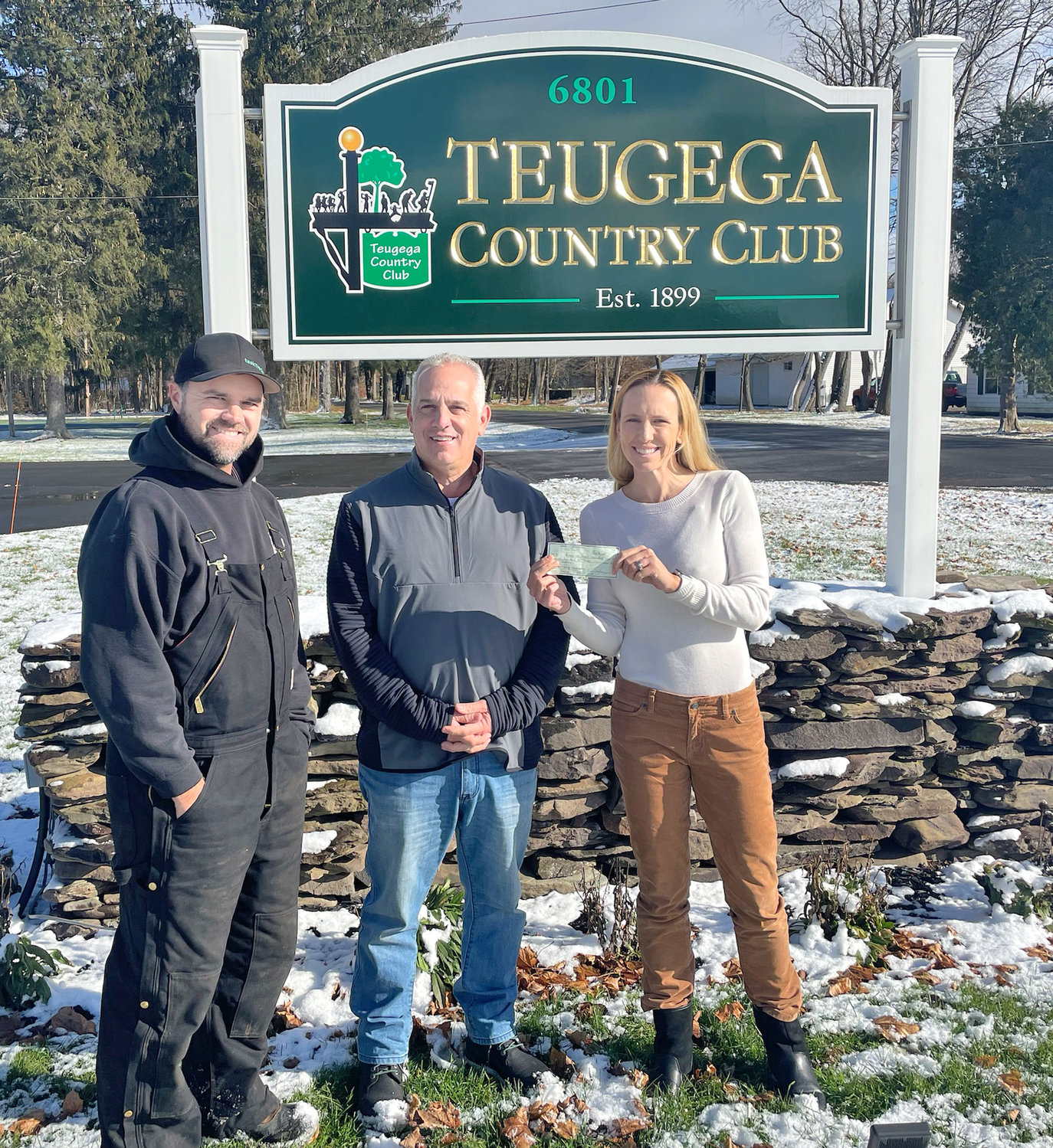 DONATION MADE — The New York State Speedgolf Open in conjunction with Speedgolf USA donated $500 in the name of Seve Campanaro to the American Heart Association on Tuesday. Seve’s father, Steve, is the head golf professional at Teugega Country Club. Pictured from left: Teugega Superintendent Ian Daniels, Steve Campanaro, and Lauren Cupp. Cupp broke the women’s speedgolf world record at Teugega in August.