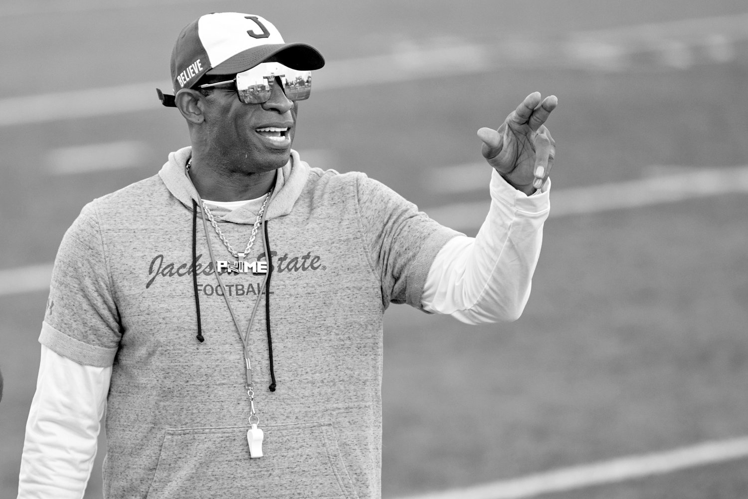 COACH PRIME — Jackson State head coach Deion Sanders points during an NCAA football game against Louisiana Monroe on Saturday, Sept. 18, in Monroe, La. Sanders has been all over national TV, putting Jackson State in the spotlight every time his insurance commercials air. Hiring Eddie George has had a similar effect at Tennessee State.