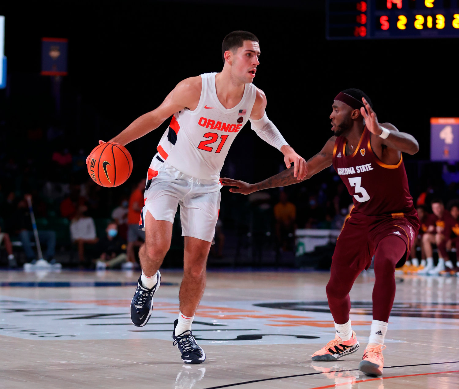 DRIVING — Syracuse forward Cole Swider (21) works against Arizona State guard Marreon Jackson (3) during an NCAA basketball game at Paradise Island, Bahamas, Thursday, Nov. 25. Syracuse bounced back from Wednesday night's loss to Virginia Commonwealth and defeated Arizona State, 92-84.
