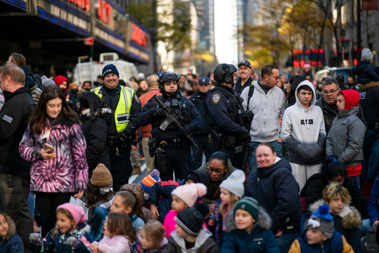 POPULAR SPOT — NYPD officers stand guard next to Radio City Music Hall as people try to watch the Macy’s Thanksgiving Day Parade Thursday in New York.