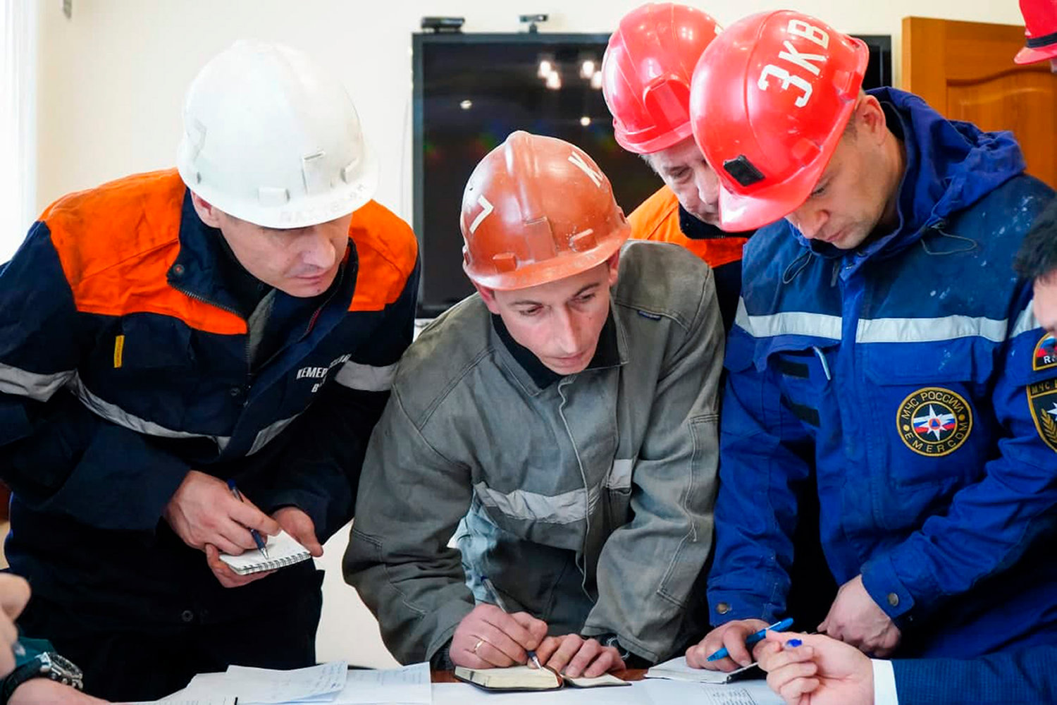 RESCUE PLAN — In this photo provided by the Governor of Kemerovo Region Press Office, rescuers attend a meeting, after the accident at the Listvyazhnaya coal mine in the Siberian city of Kemerovo, about 1,900 miles east of Moscow, Russia Thursday.