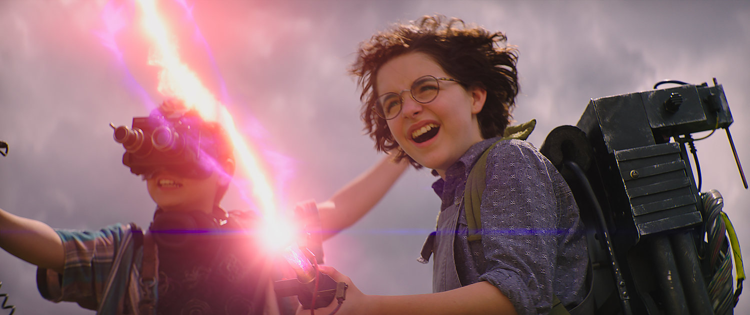 GHOST ZAPPER — This image released by Sony Pictures shows Mckenna Grace and Logan Kim, left, in a scene from “Ghostbusters: Afterlife.”