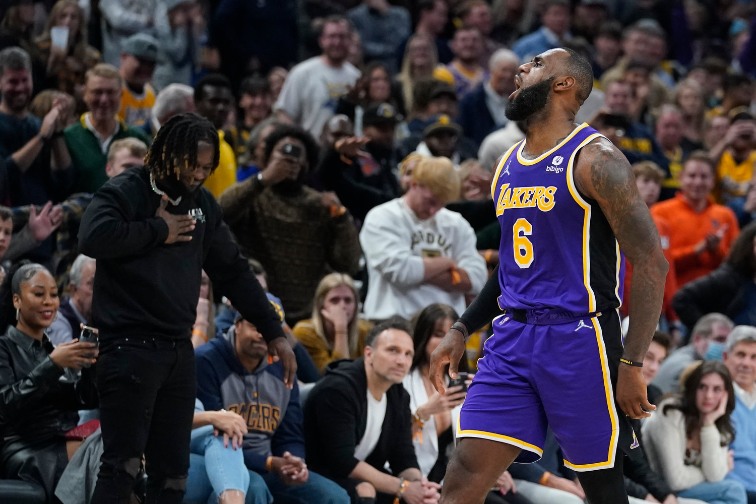 FINED — Los Angeles Lakers' LeBron James reacts after hitting a shot during overtime of in the team's NBA basketball game against the Indiana Pacers, Wednesday, Nov. 24, in Indianapolis. James has been fined $15,000 by the NBA for an obscene gesture.