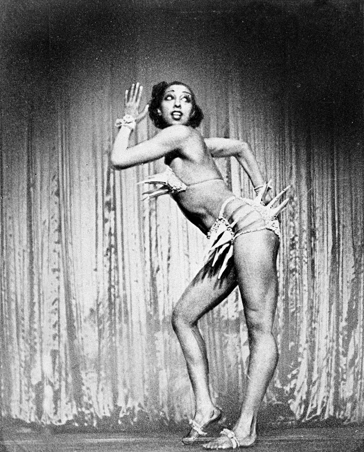 FILE - Performer Josephine Baker strikes a pose during her Ziegfeld Follies performance of "The Conga" on the Winter Garden Theater stage in New York, Feb. 11, 1936. France is inducting Josephine Baker ‚Äì Missouri-born cabaret dancer, French Resistance fighter and civil rights leader ‚Äì into its Pantheon, the first Black woman honored in the final resting place of France's most revered luminaries. (AP Photo, File)