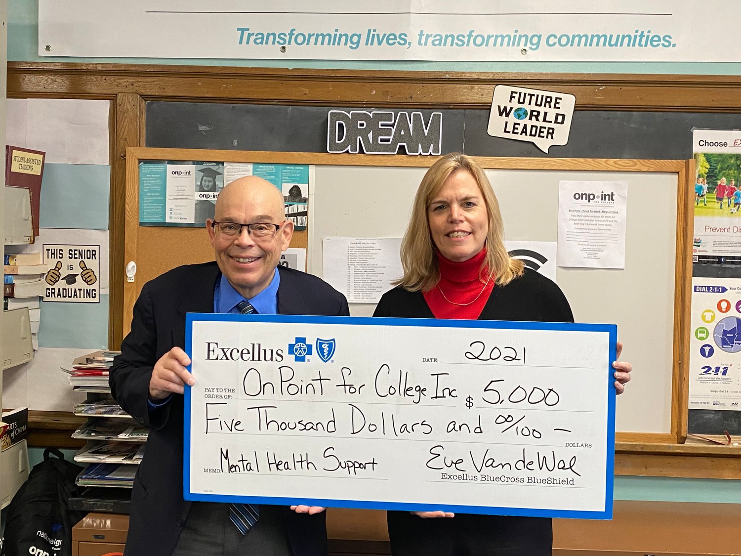 FUNDS TO SUPPORT MENTAL HEALTH EFFORT — Eve Van de Wal, Excellus BlueCross BlueShield Utica regional president, right,  presents Kevin Marken, Utica director of On Point for College with a $5,000 grant to help support a new mental health program for students.