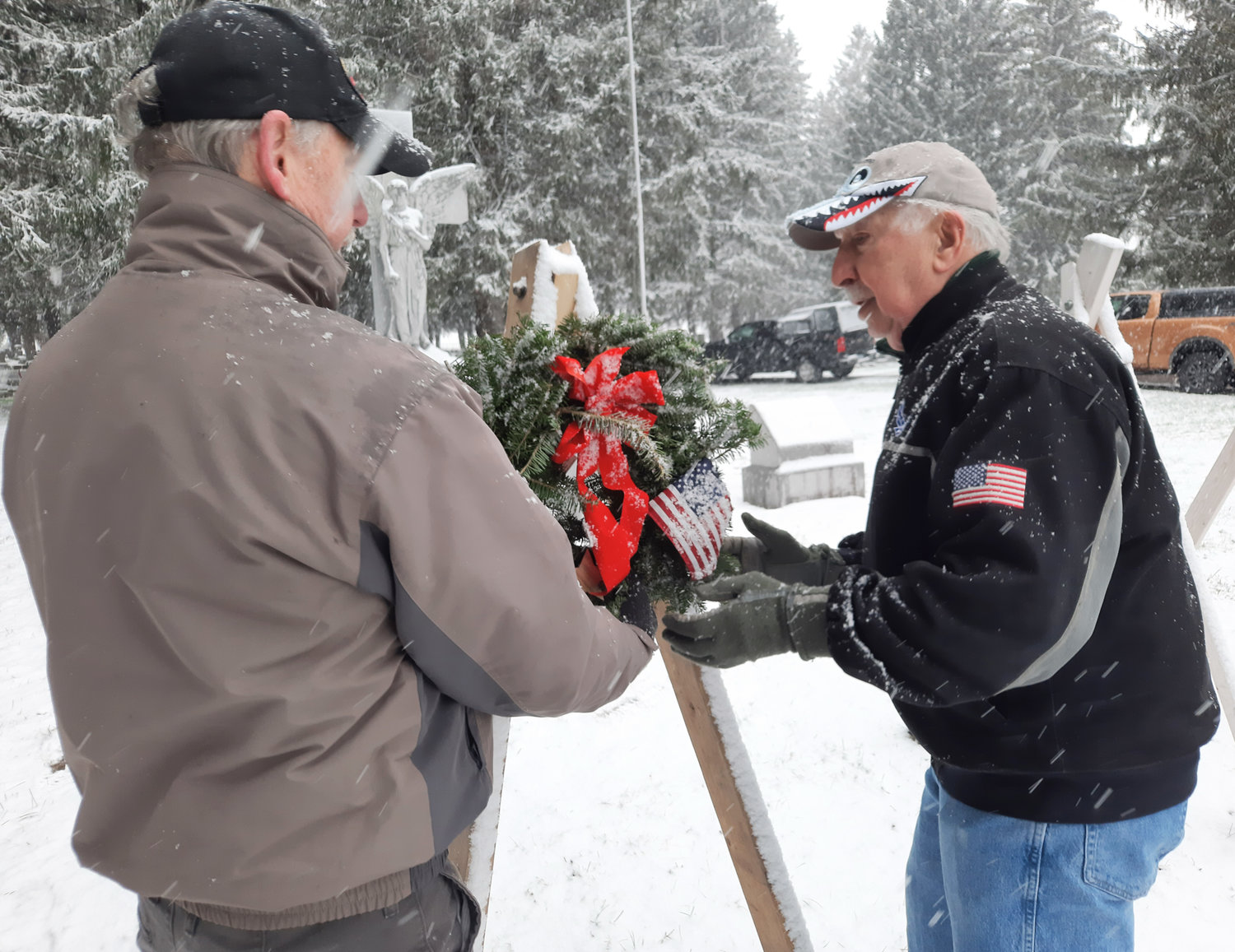 WREATHS ACROSS AMERICA — Members of the Lee American Legion place a wreath dedicated to the U.S. Army at Evergreen Cemetery in Lee. Wreaths Across America began in 1992 as a way to pay tribute to veterans across the country. In 2020, WAA and its volunteers laid over 1.7 million veterans' wreaths at more than 2,500 participating locations in all 50 U.S. states, at sea, and abroad.