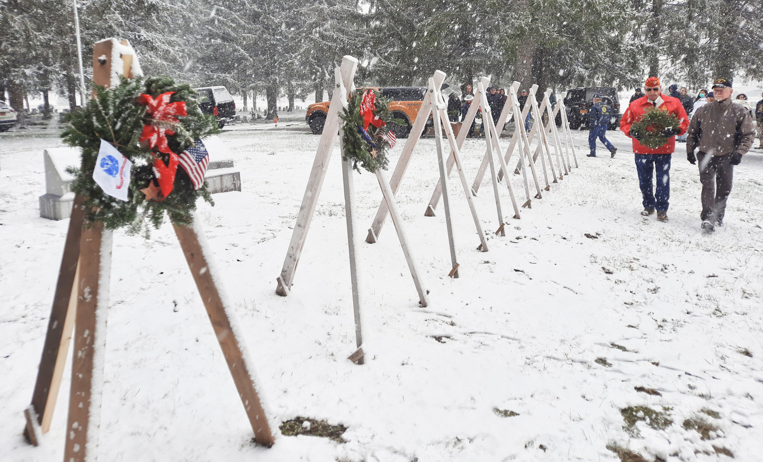REMEMBERED ON A COLD WINTER — Wreaths are carried and dedicated to all those who have served in the military for Wreaths Across America. The Lee American Legion performs the ceremony at Evergreen Cemetery in Lee.