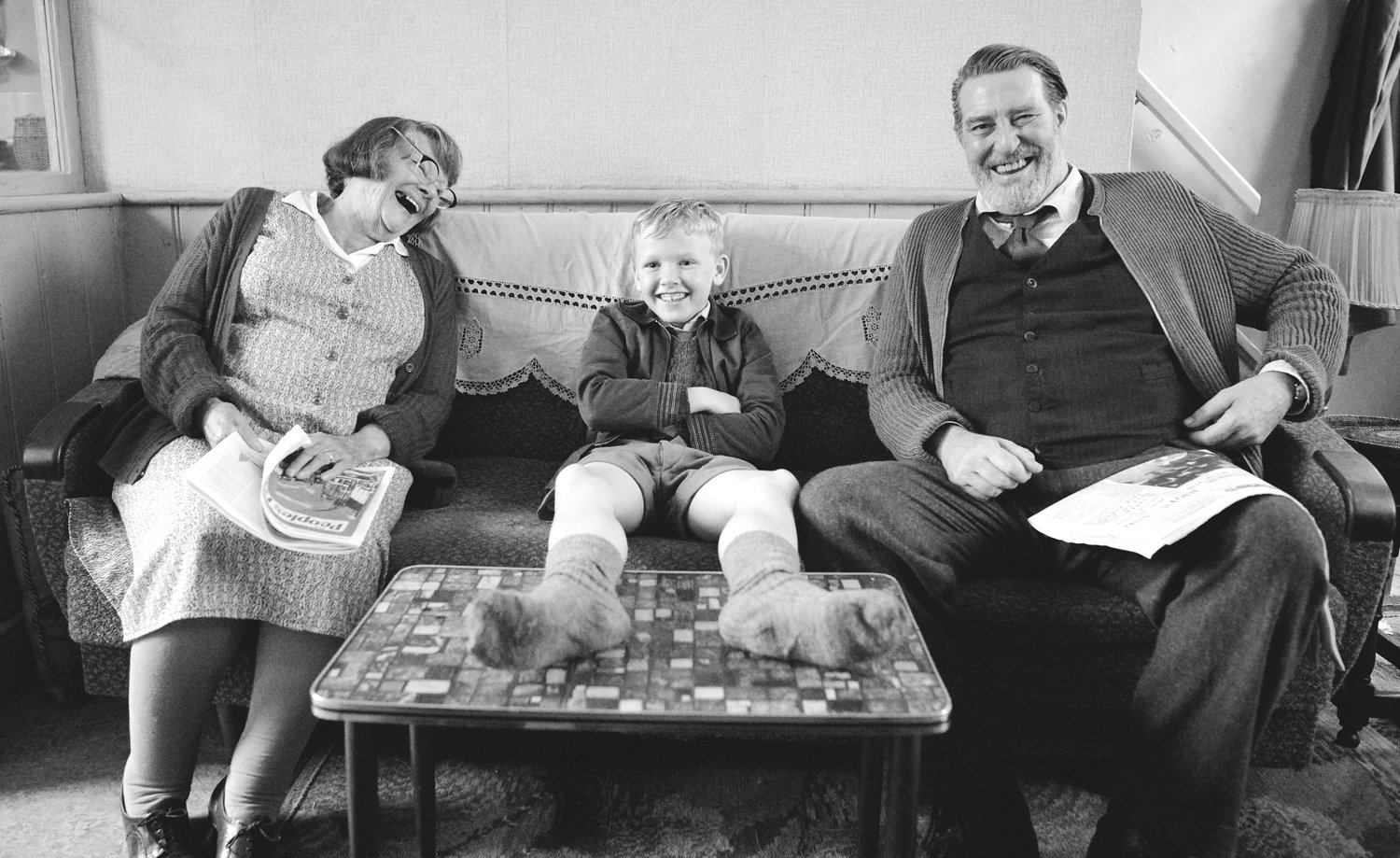 Heartfelt — From left, Judi Dench as “Granny,” Jude Hill as “Buddy” and Ciarán Hinds as “Pop” in director Kenneth Branagh’s “Belfast.”