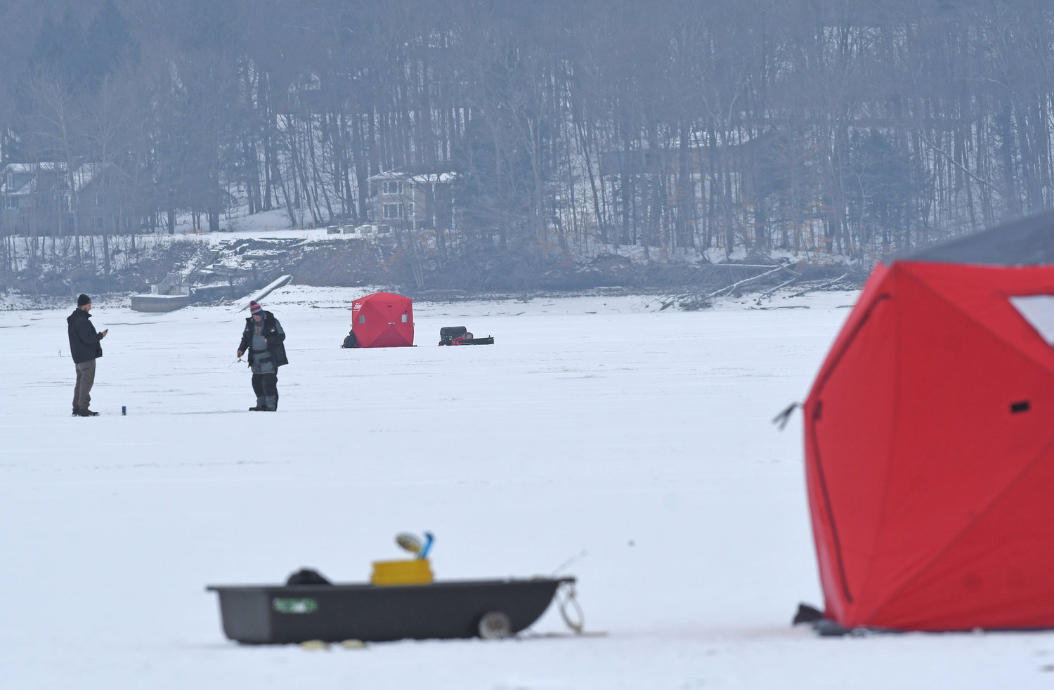 NEARLY THERE — As colder weather approaches, prospective ice fishermen — such as these shown in this February 2021 file photo from Delta Lake — are urged to use common sense and a host of safety precautions by the state Department of Environmental Conservation.