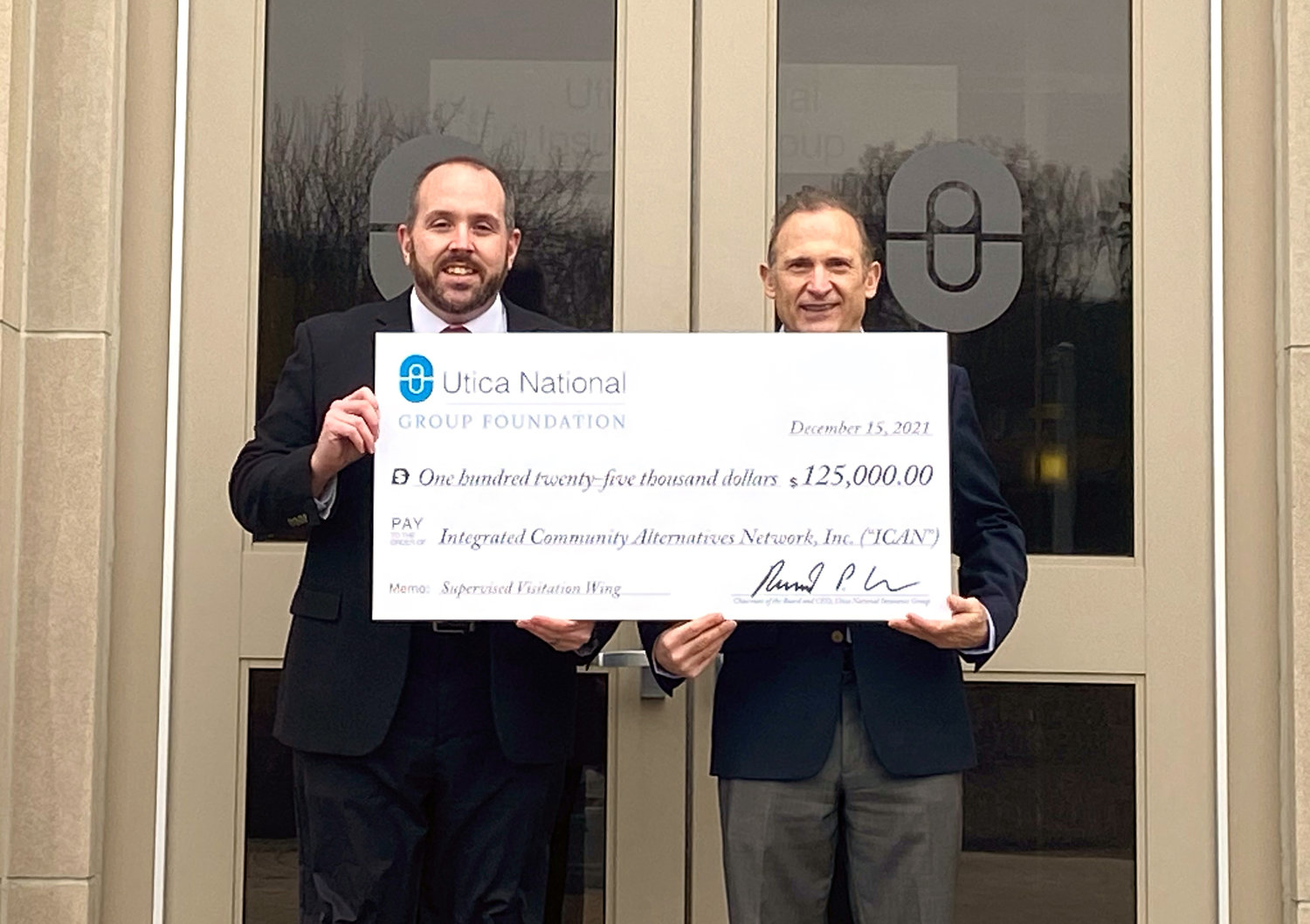 CHECK PRESENTATION — Pictured from left are Steven Bulger, ICAN CEO/Executive Director, and Bernard Turi, Esq., Screening Committee Chair - Utica National Group Foundation/Executive Vice President,  General Counsel, General Auditor & Chief Risk Officer – Utica National Insurance Group.