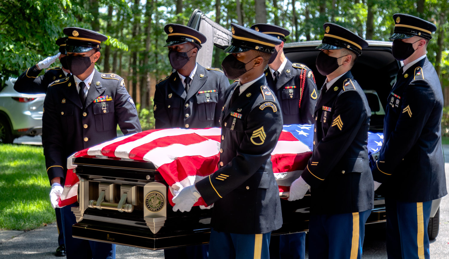 MILITARY FUNERAL SERVICE — Members of the New York Army National Guard Honor Guard carry the casket of Army National Guard Sgt. 1st Class Henry Colon during military funeral services at Calverton National Cemetery in Wading River on July 7.