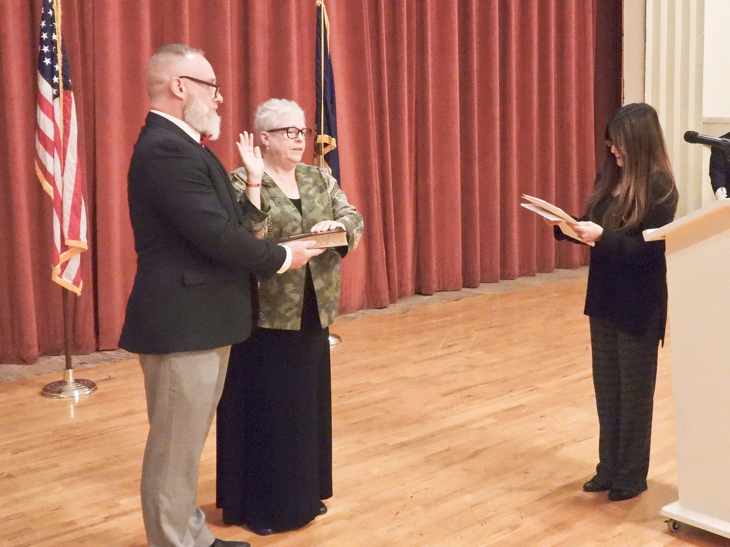TWO MORE YEARS — Helen Acker is sworn in as Oneida's mayor for another two years at the inauguration ceremony on Sunday. Acker's son and master of ceremonies, Justin Acker, holds the bible for her as she takes the oath of Office.