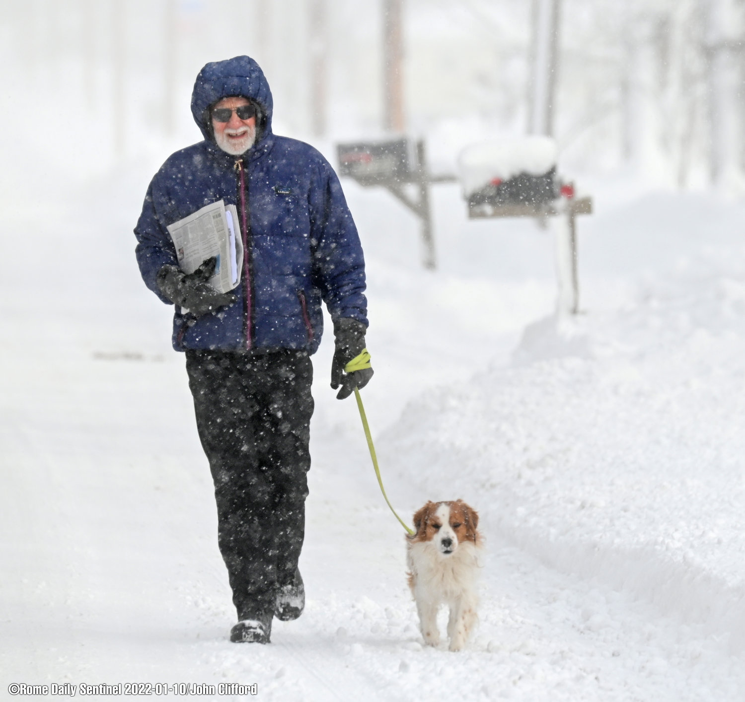 Carl Hafner of Main Street in Westernville takes a snowy walk on Monday, Jan. 10, 2022.



Carl Hafner of Westernville walks his dog, Leo, 3 down Main St. According to Hafner and his backyard measuring stick Westernville got 14 inches of new snow over night with another round to go.