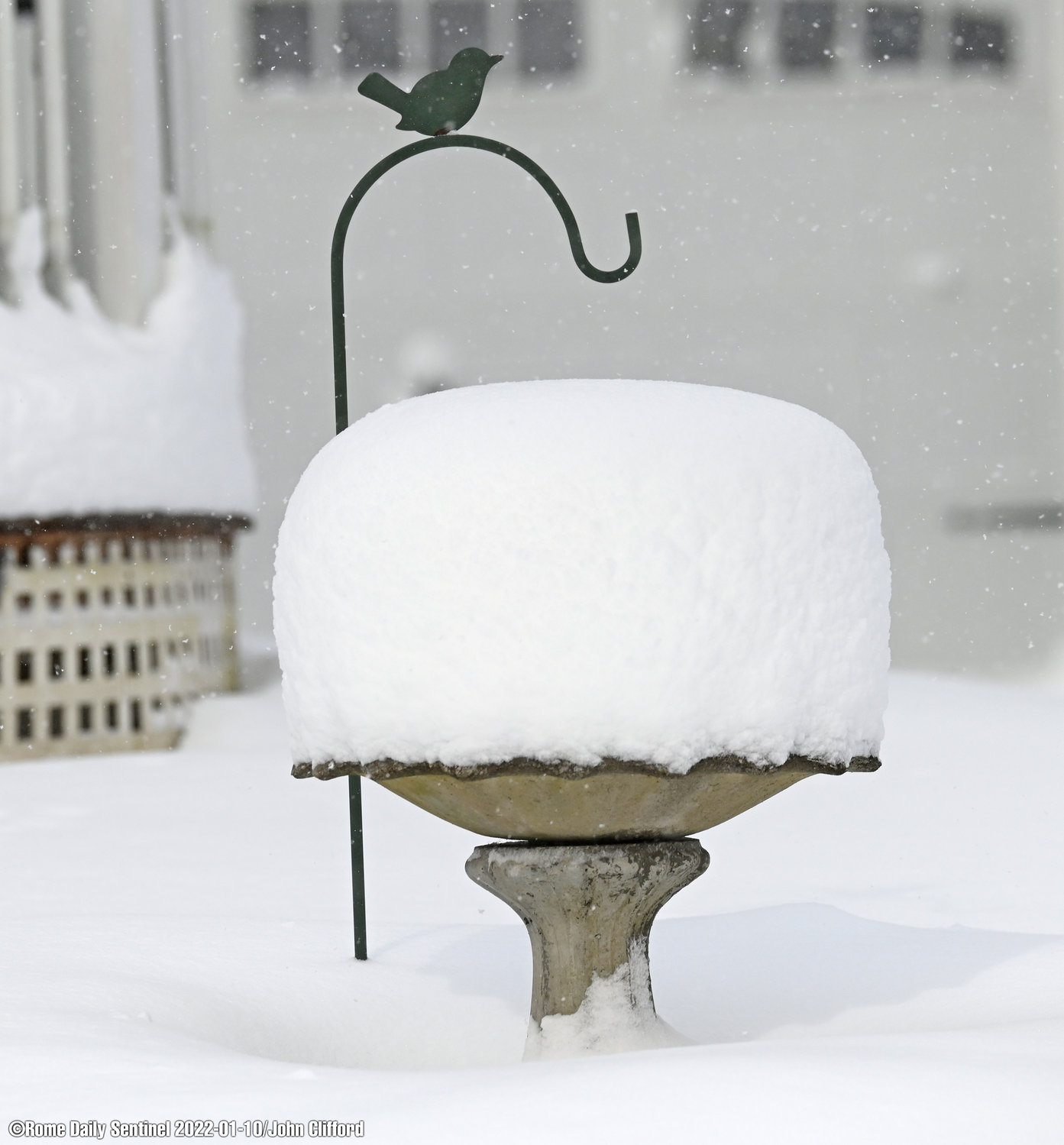 Early Monday, a bird bath in Westernville displayed the 14 inches of snow that piled up overnight Sunday into Monday. Monday afternoon, weather reports called for another round of snow to go.
