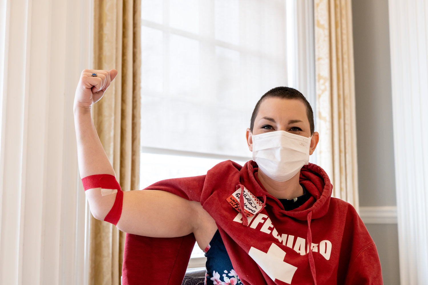 LOW SUPPLY, HIGH DEMAND — A blood donor shows a bandaged arm after making a donation for the American Red Cross in this February file photo. The Red Cross warns that donors are urgently needed, particularly those who are type O or those donating platelets.
