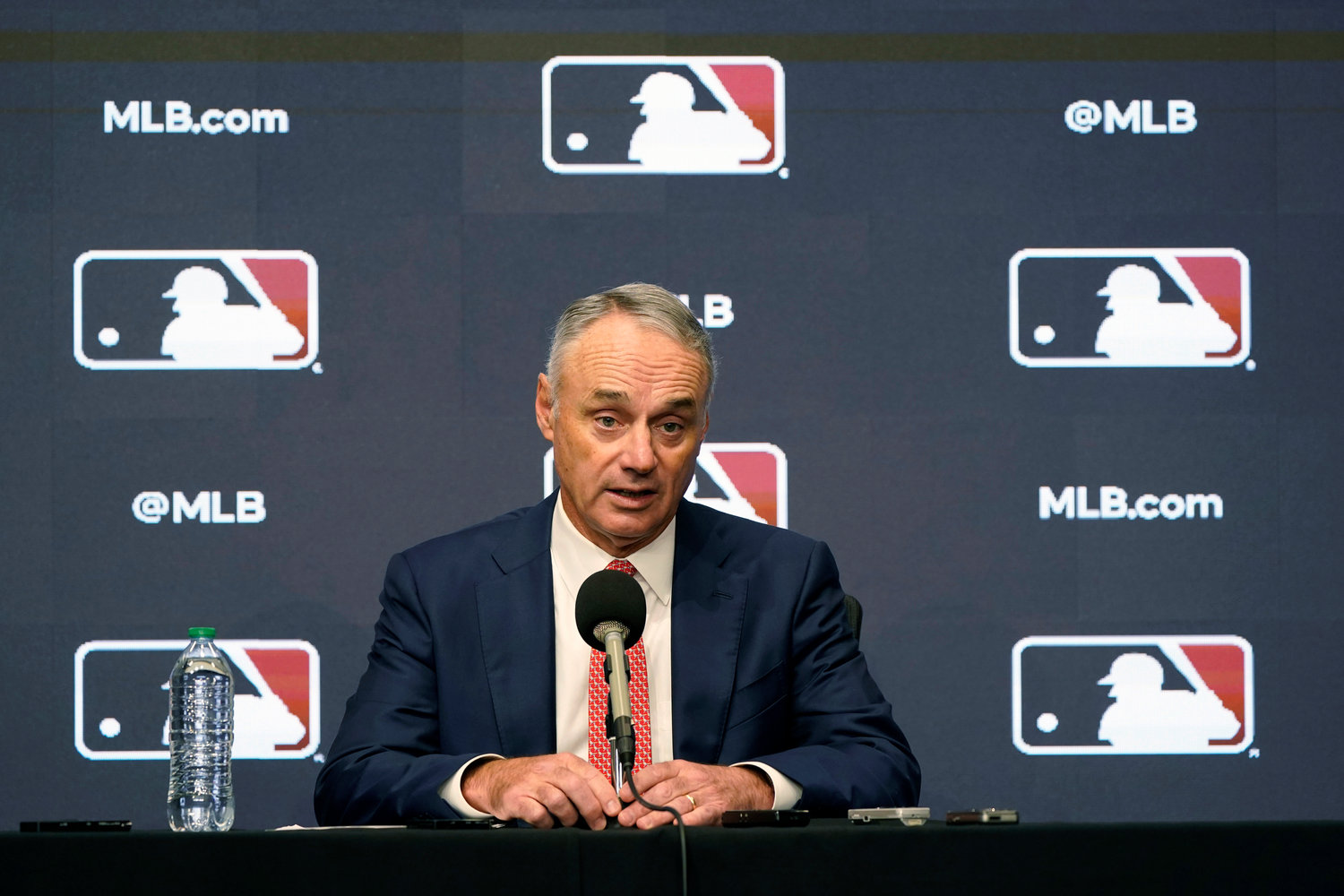 FILE - Major League Baseball commissioner Rob Manfred speaks during a news conference in Arlington, Texas, Thursday, Dec. 2, 2021. Major League Baseball and the players‚Äô association are scheduled to meet Thursday, Jan. 13, 2022, in the first negotiations between the parties since labor talks broke off Dec. 1. The planning of the meeting was disclosed to The Associated Press by a person familiar with the negotiations who spoke on condition of anonymity because no announcement was made. (AP Photo/LM Otero, File)