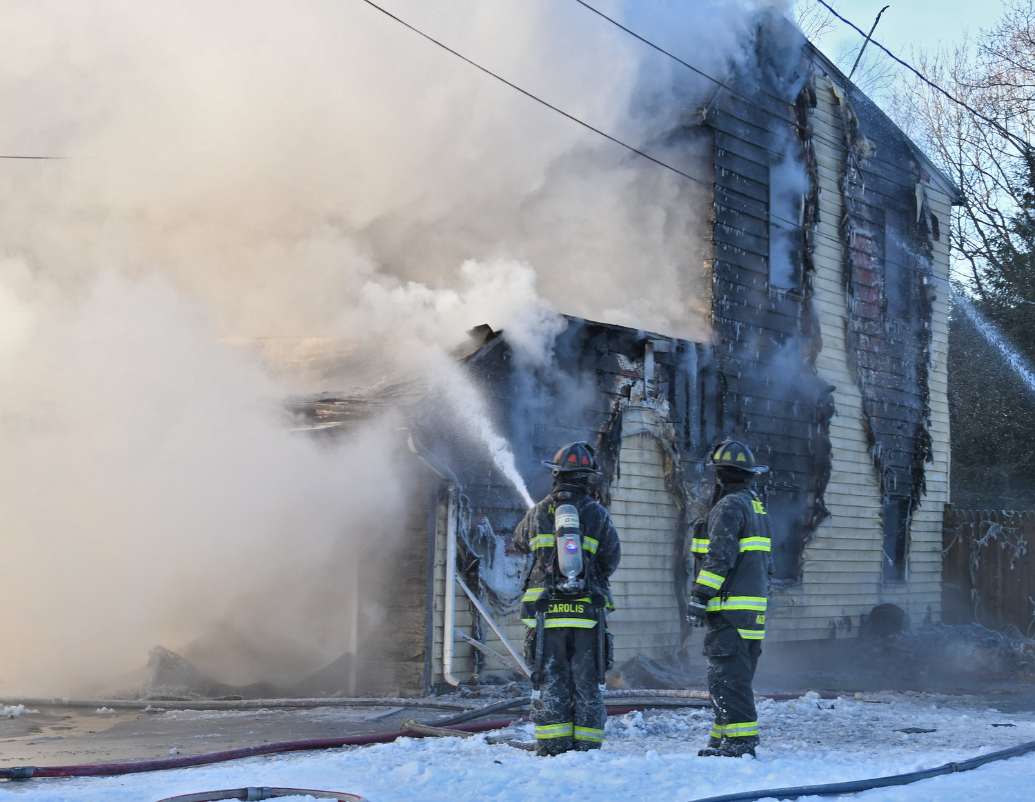 NO FOUL PLAY — Rome firefighters battle the early morning blaze at 1715 N. James St. on Saturday. Fire officials said the sole resident, an 83-year-old woman, perished in the fire. The cause remains under investigation.