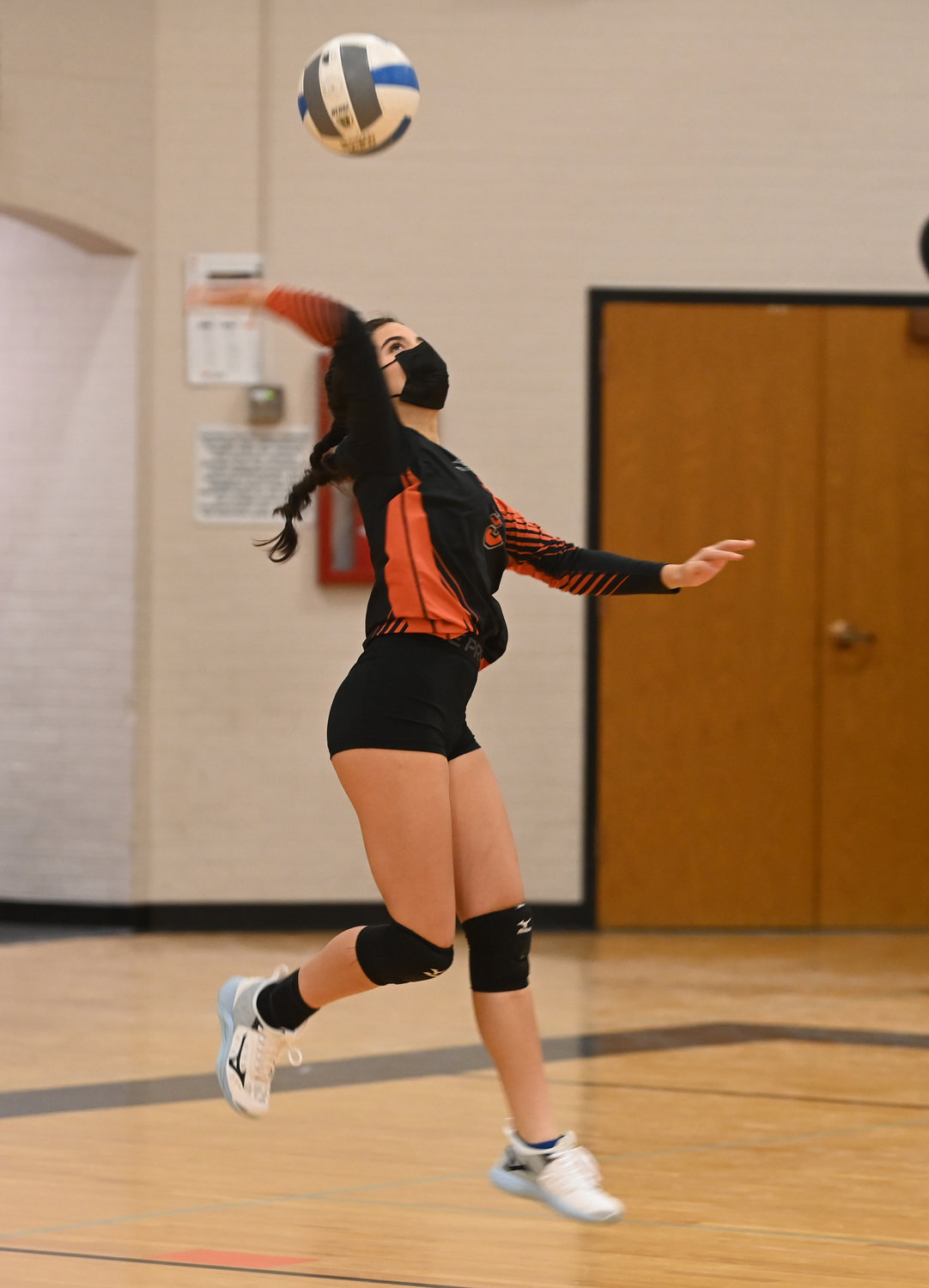 LOOKING FOR AN ACE — Jenavieve Cianfrocco of Rome Free Academy winds up for a serve against Oneida Monday night at home in the Tri-Valley League. match The Black Knights won 3-0.